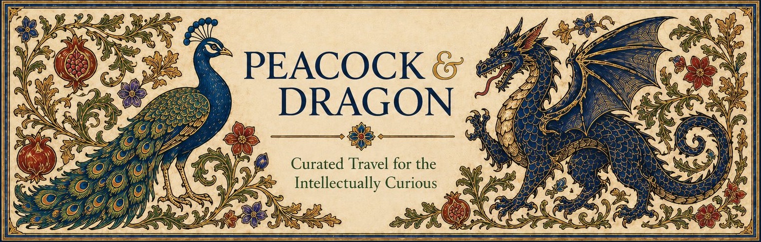 Peacock & Dragon Journeys — Curated Travel for the Intellectually Curious. A peacock and a dragon flank an illuminated wordmark amid foliate ornament with pomegranates and roses.