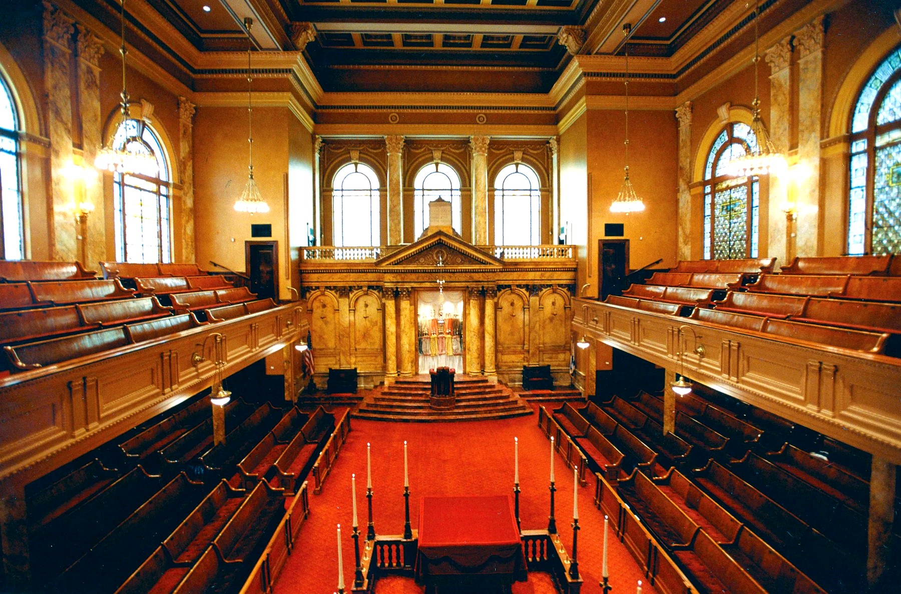 Interior of Congregation Shearith Israel, New York — central tevah, Ark and Heikhal beyond, balconied galleries.